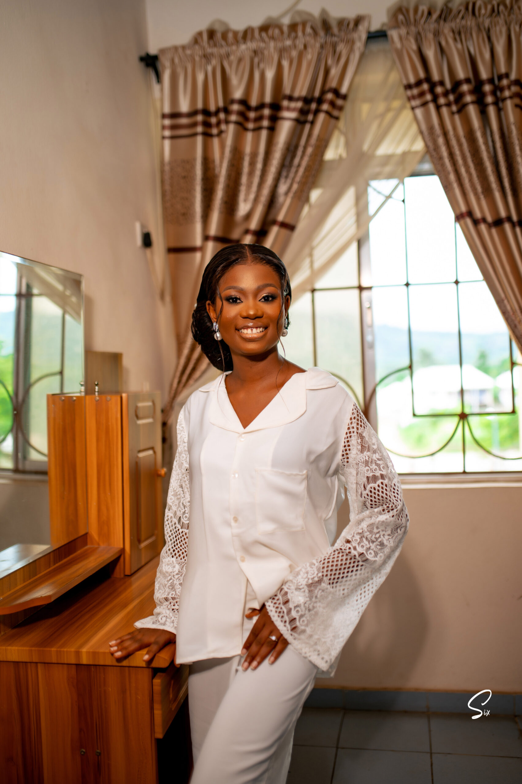 Bride in her white wedding robe