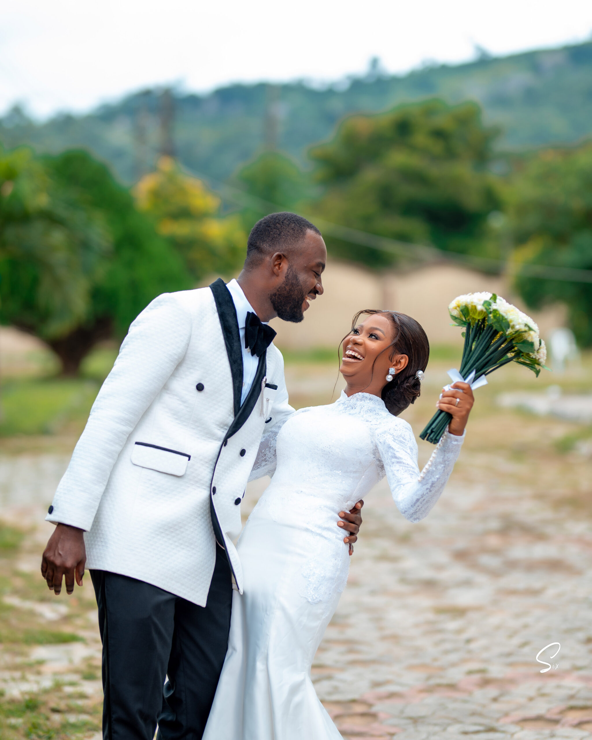 Esther and Dayo in their church wedding outfit.