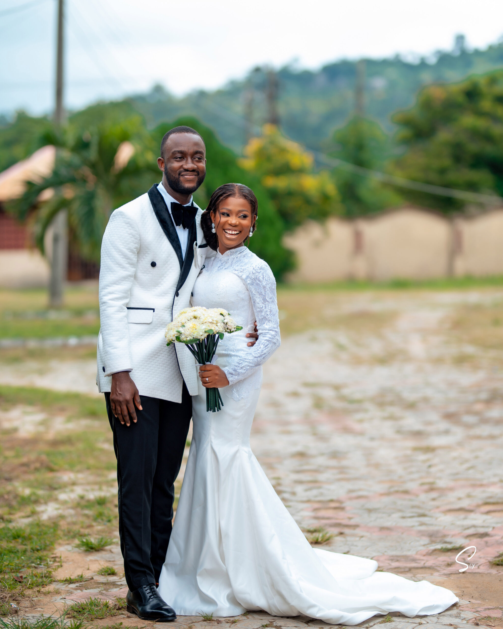 Esther and Dayo in their church wedding outfit.